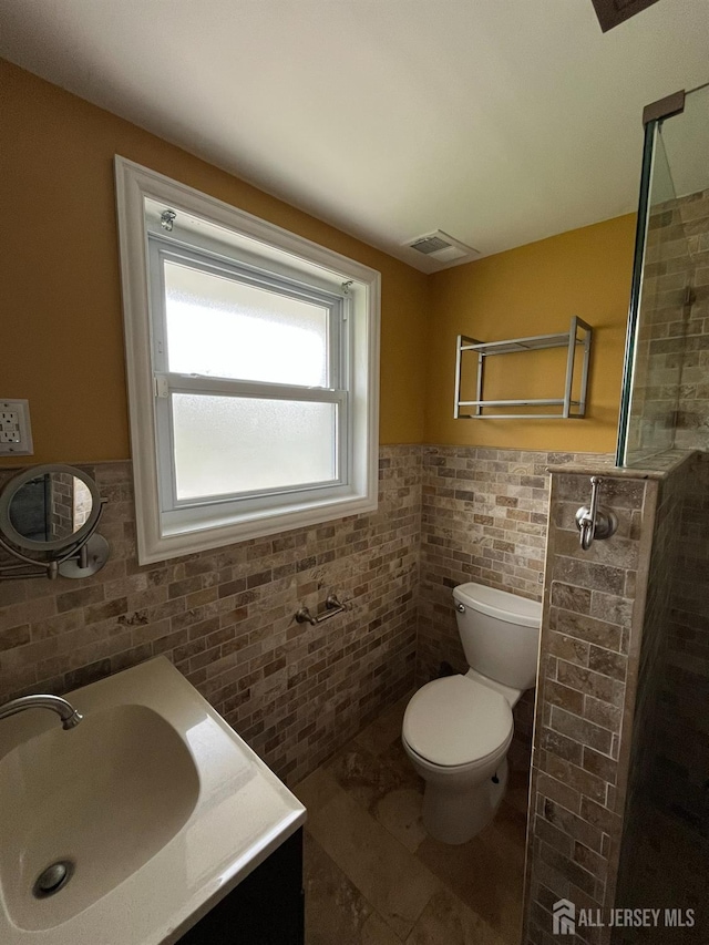 860 Barry Ave, Perth Amboy, NJ 08861 - full bath featuring tile walls, a wainscoted wall, tiled shower, vanity, and tile patterned flooring