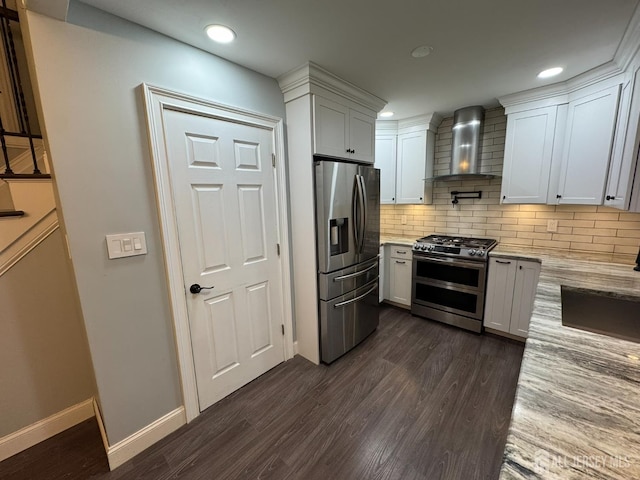 860 Barry Ave, Perth Amboy, NJ 08861 - kitchen with appliances with stainless steel finishes, wall chimney exhaust hood, dark wood-type flooring, light stone counters, and decorative backsplash