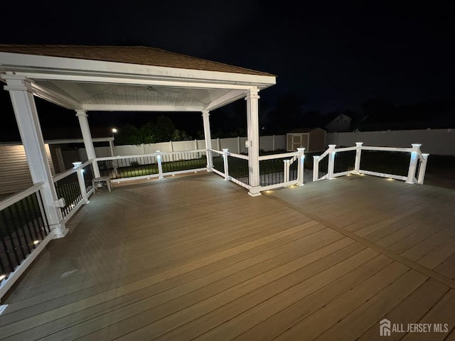 860 Barry Ave, Perth Amboy, NJ 08861 - deck at twilight featuring a storage shed and a gazebo