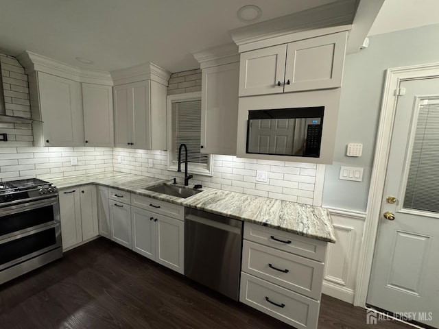 860 Barry Ave, Perth Amboy, NJ 08861 - kitchen with appliances with stainless steel finishes, white cabinetry, backsplash, and light stone counters