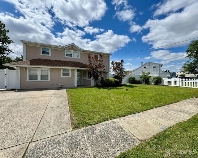 860 Barry Ave, Perth Amboy, NJ 08861 - traditional-style house featuring stucco siding and a gate