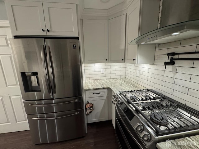 860 Barry Ave, Perth Amboy, NJ 08861 - kitchen featuring stainless steel fridge, range with gas stovetop, wall chimney exhaust hood, light stone counters, and decorative backsplash