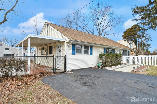 view of front of house featuring a carport