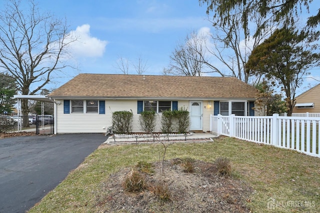 single story home featuring a front yard and a carport