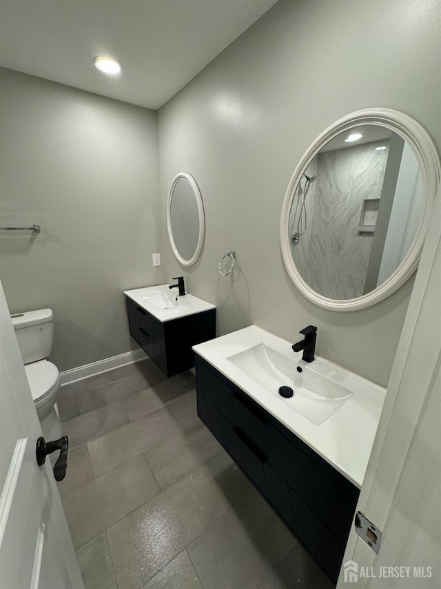 8 Woodlot Rd, East Brunswick, NJ 08816 - full bath featuring two vanities, toilet, recessed lighting, baseboards, and a shower