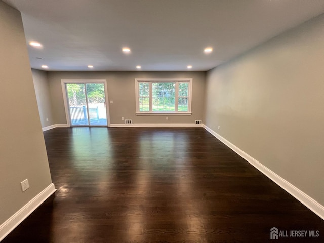 8 Woodlot Rd, East Brunswick, NJ 08816 - empty room featuring dark wood finished floors, baseboards, and recessed lighting