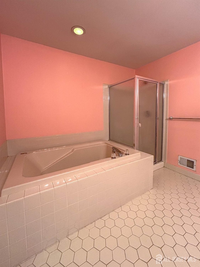 bathroom featuring a garden tub, a stall shower, and recessed lighting