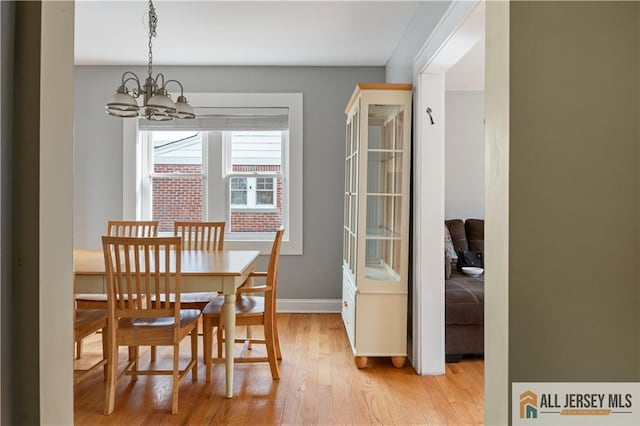 16 Lafayette Ave, Edison, NJ 08837 - dining space featuring a chandelier, light wood-style flooring, and baseboards