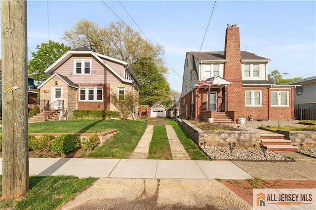 16 Lafayette Ave, Edison, NJ 08837 - view of front facade with a chimney, brick siding, a front yard, and an outdoor structure