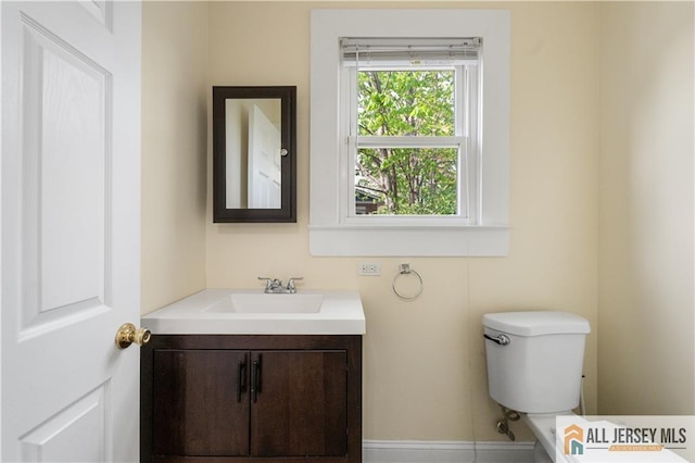 16 Lafayette Ave, Edison, NJ 08837 - bathroom featuring vanity, toilet, and baseboards