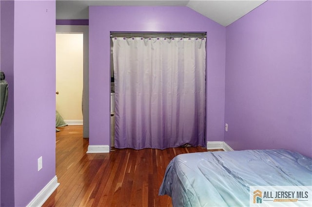 16 Lafayette Ave, Edison, NJ 08837 - bedroom with hardwood / wood-style flooring, baseboards, and vaulted ceiling