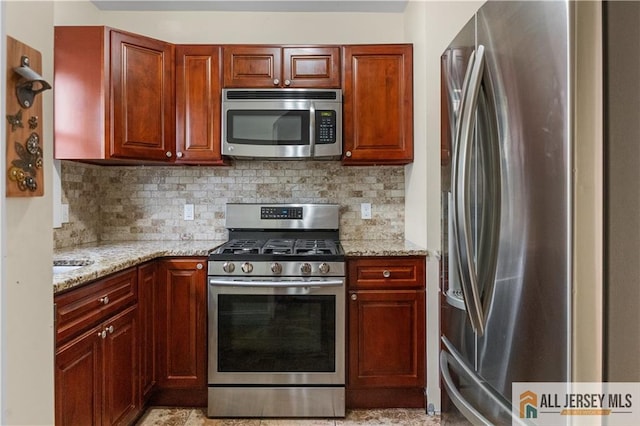 16 Lafayette Ave, Edison, NJ 08837 - kitchen featuring appliances with stainless steel finishes, light stone counters, and decorative backsplash