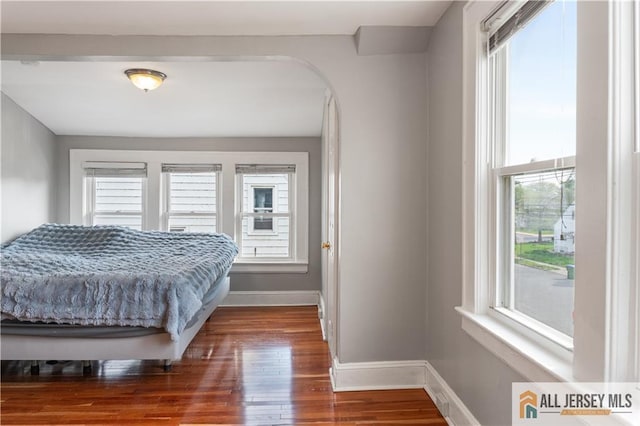 16 Lafayette Ave, Edison, NJ 08837 - bedroom featuring baseboards, wood finished floors, and arched walkways