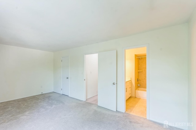 95 Lexington Cir, Old Bridge, NJ 07747 - unfurnished bedroom featuring light carpet and ensuite bathroom