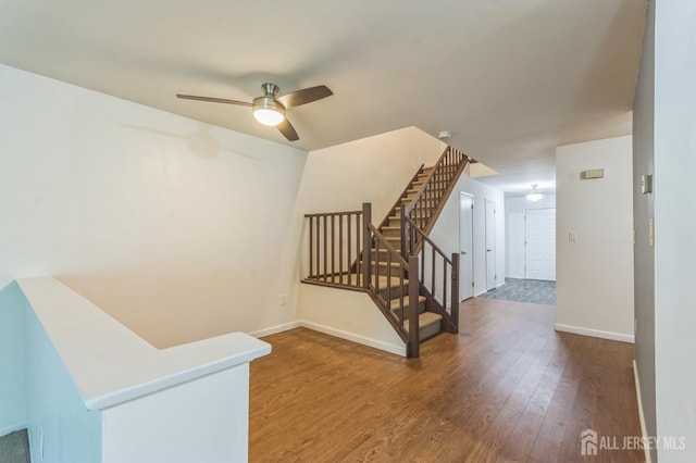 95 Lexington Cir, Old Bridge, NJ 07747 - stairs with wood finished floors, a ceiling fan, and baseboards