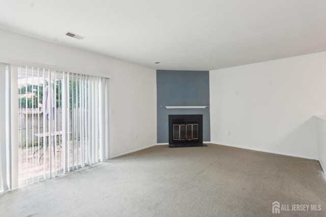 95 Lexington Cir, Old Bridge, NJ 07747 - unfurnished living room featuring carpet, a fireplace with flush hearth, and baseboards