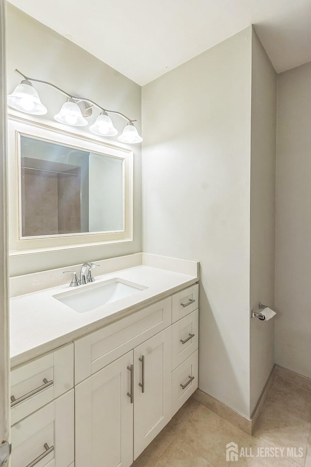 95 Lexington Cir, Old Bridge, NJ 07747 - bathroom featuring vanity, tile patterned floors, and baseboards