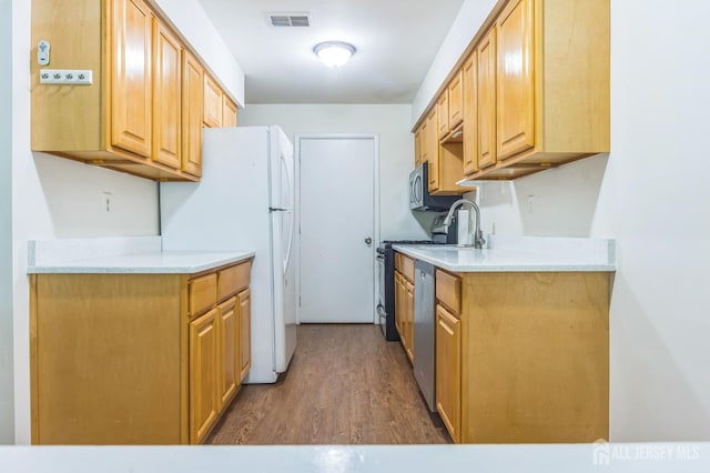 95 Lexington Cir, Old Bridge, NJ 07747 - kitchen with dishwasher, wood finished floors, freestanding refrigerator, and light countertops