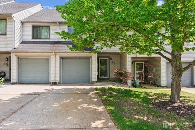 95 Lexington Cir, Old Bridge, NJ 07747 - townhome / multi-family property with a shingled roof, driveway, and a garage