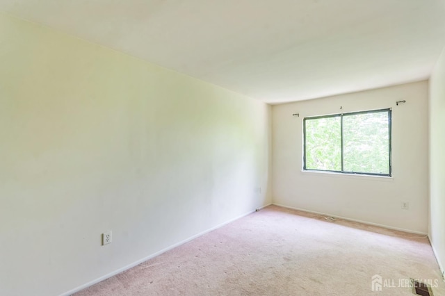 95 Lexington Cir, Old Bridge, NJ 07747 - spare room featuring light colored carpet and baseboards