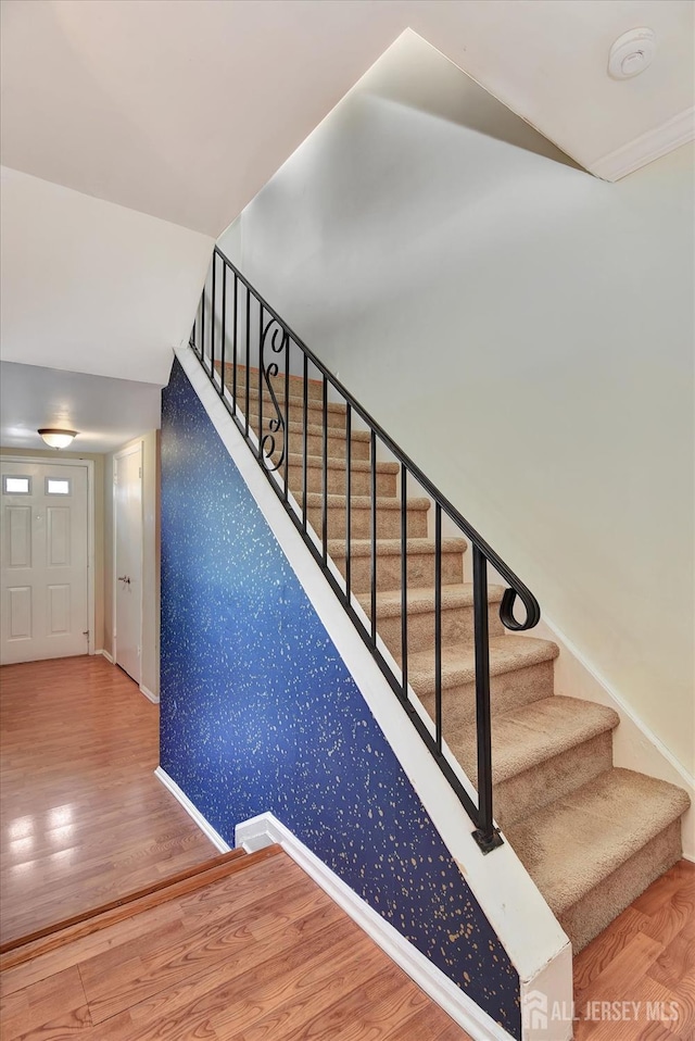 65 Brookview Cir, Jamesburg, NJ 08831 - stairs with baseboards, wallpapered walls, and wood finished floors