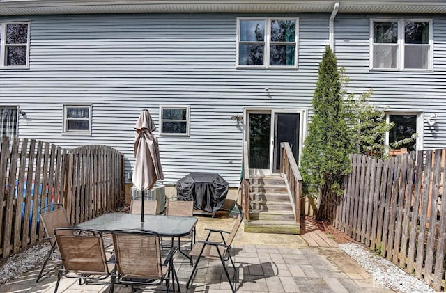 65 Brookview Cir, Jamesburg, NJ 08831 - back of property featuring entry steps, cooling unit, a fenced backyard, and a patio area