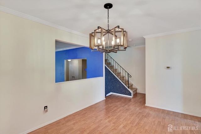65 Brookview Cir, Jamesburg, NJ 08831 - unfurnished room featuring stairs, crown molding, a notable chandelier, and wood finished floors
