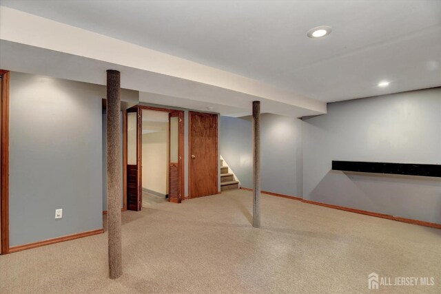 65 Brookview Cir, Jamesburg, NJ 08831 - finished below grade area with stairway, baseboards, recessed lighting, and carpet