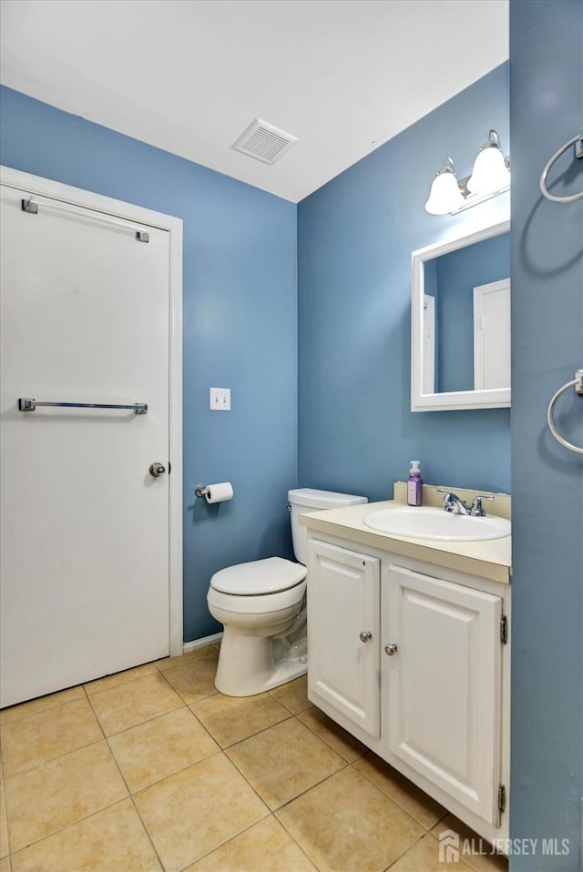 65 Brookview Cir, Jamesburg, NJ 08831 - half bath featuring visible vents, tile patterned flooring, toilet, and vanity
