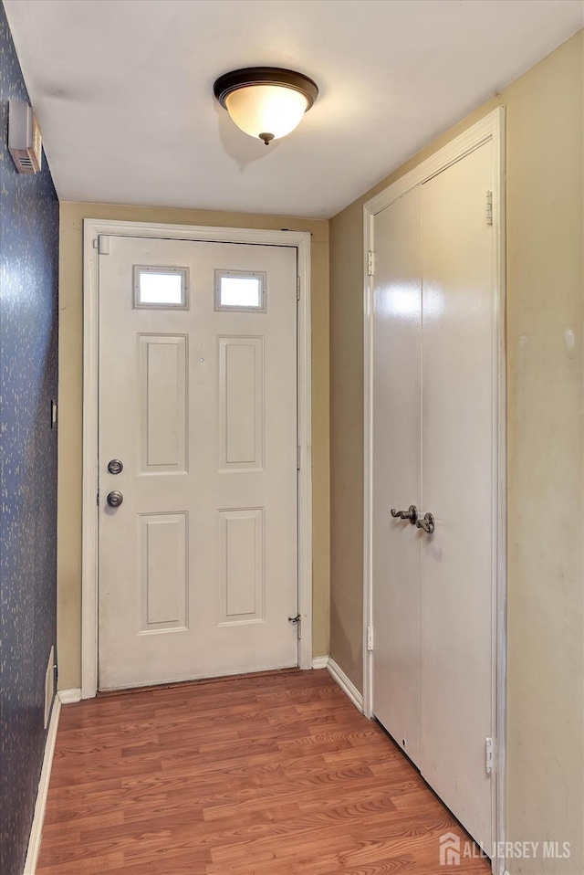 65 Brookview Cir, Jamesburg, NJ 08831 - doorway to outside with baseboards and light wood-style flooring