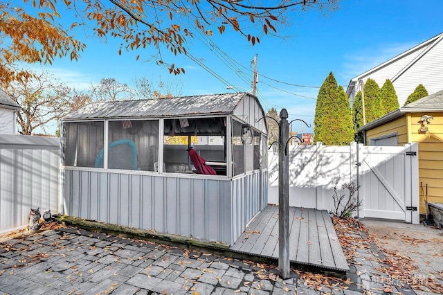 exterior space featuring a sunroom