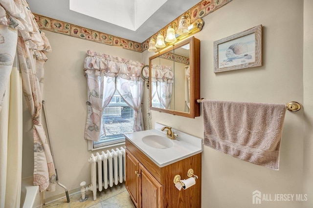 bathroom with radiator, shower / bathtub combination with curtain, tile patterned flooring, vanity, and a skylight