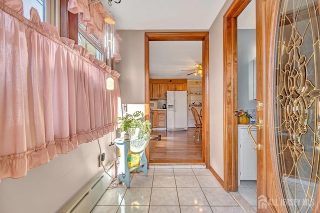 corridor featuring light tile patterned floors