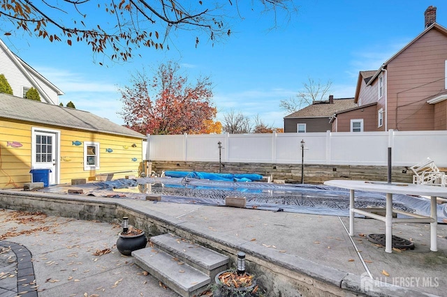 view of patio with a covered pool