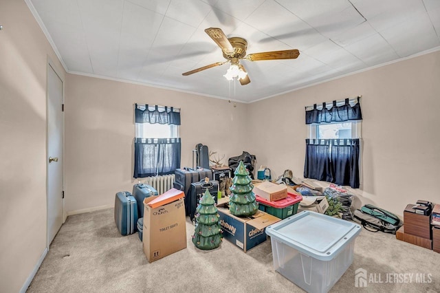 interior space with light carpet, ceiling fan, and crown molding