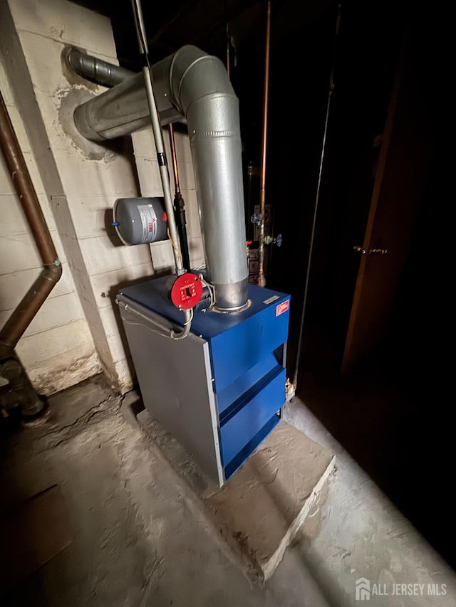 450 Brace Ave, Perth Amboy, NJ 08861 - utility room featuring a heating unit