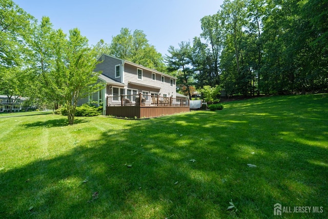 5 Wedgewood Ln, Holmdel, NJ 07733 - back of property with a yard and a deck