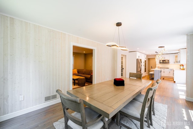 5 Wedgewood Ln, Holmdel, NJ 07733 - dining room with light wood-type flooring and crown molding