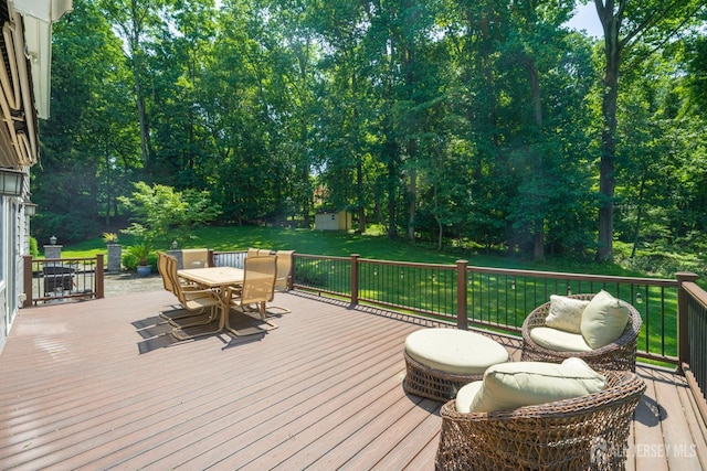 5 Wedgewood Ln, Holmdel, NJ 07733 - wooden terrace with outdoor dining area, a lawn, and an outdoor structure