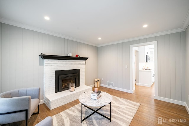 5 Wedgewood Ln, Holmdel, NJ 07733 - living room with light wood-type flooring, a fireplace, crown molding, and recessed lighting
