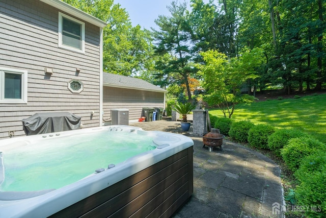 5 Wedgewood Ln, Holmdel, NJ 07733 - view of patio with a hot tub, an outdoor fire pit, and a grill