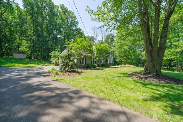 5 Wedgewood Ln, Holmdel, NJ 07733 - view of property hidden behind natural elements with a front lawn