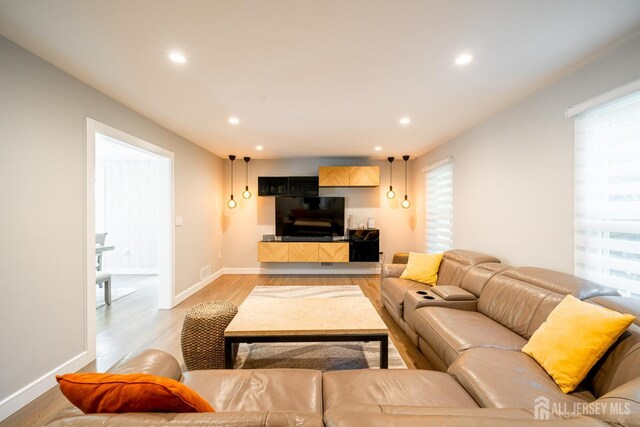 5 Wedgewood Ln, Holmdel, NJ 07733 - living area with light wood-type flooring, recessed lighting, and plenty of natural light