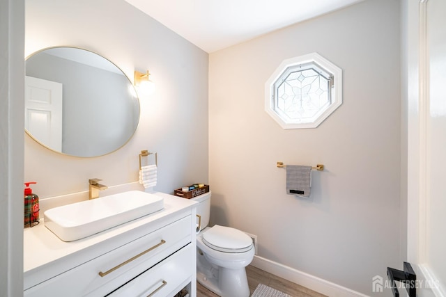 5 Wedgewood Ln, Holmdel, NJ 07733 - half bathroom featuring vanity and wood finished floors