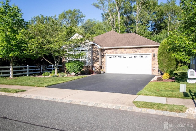 128 Fontaine Ct, Monroe, NJ 08831 - view of front of property with driveway, a garage, and stone siding