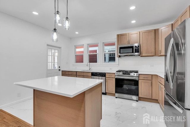 kitchen with a kitchen island, sink, stainless steel appliances, and hanging light fixtures