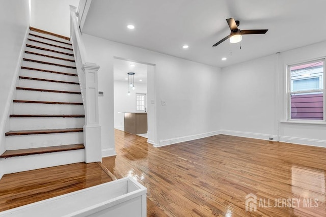 interior space with hardwood / wood-style floors, plenty of natural light, and ceiling fan