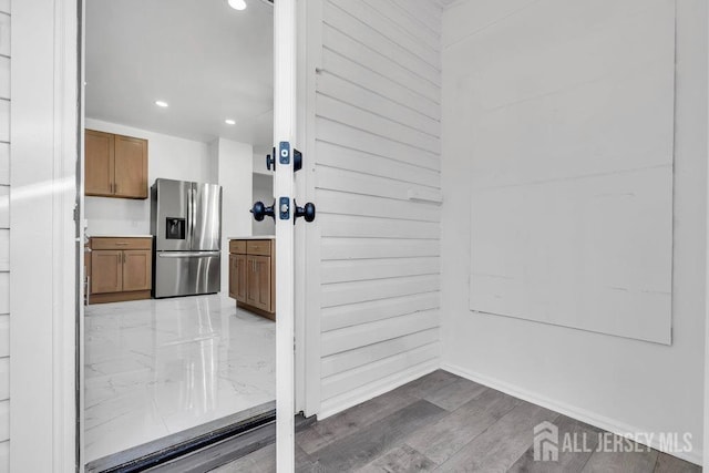 interior space with stainless steel refrigerator with ice dispenser