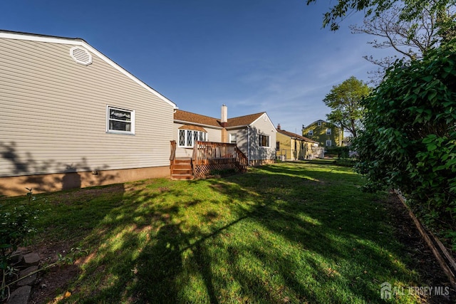 109 Russell St, Woodbridge Proper, NJ 07095 - view of green lawn with a wooden deck