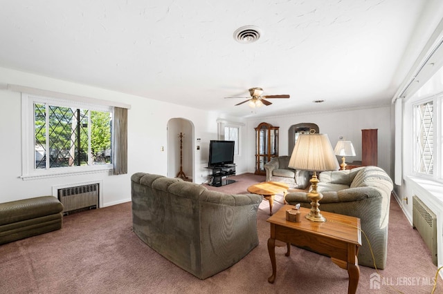109 Russell St, Woodbridge Proper, NJ 07095 - carpeted living area with radiator, arched walkways, and a ceiling fan